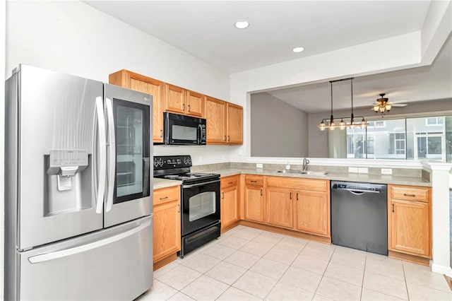 kitchen with black appliances, sink, hanging light fixtures, light tile patterned floors, and ceiling fan