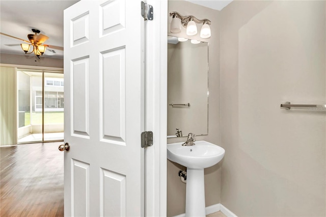 bathroom featuring ceiling fan and hardwood / wood-style flooring