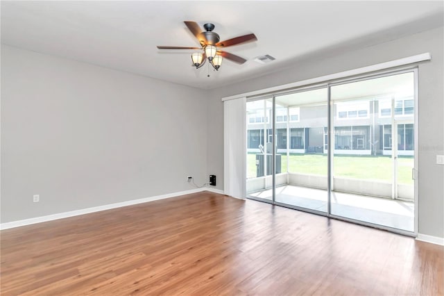 unfurnished room featuring ceiling fan and wood-type flooring