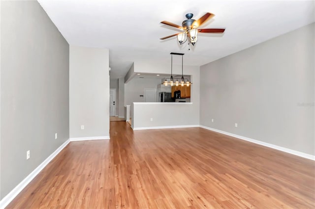 unfurnished living room with light hardwood / wood-style flooring and ceiling fan