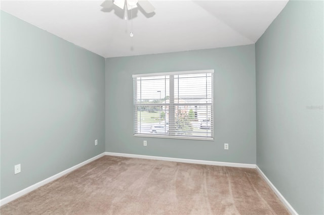 carpeted empty room with ceiling fan