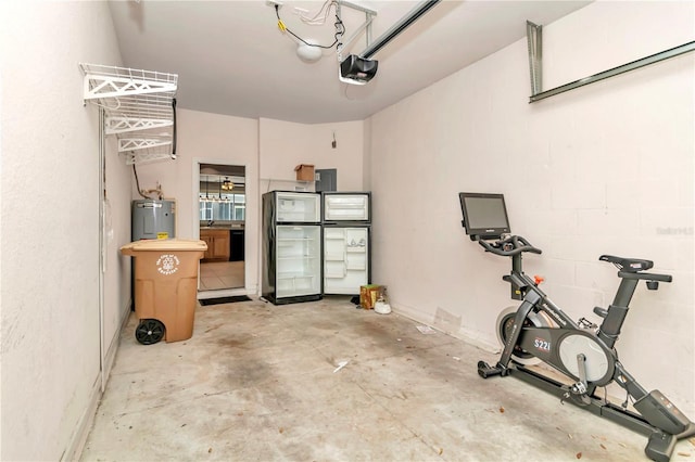 garage with electric water heater and a garage door opener