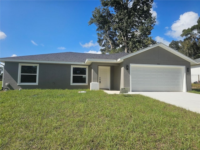 single story home featuring a garage and a front yard