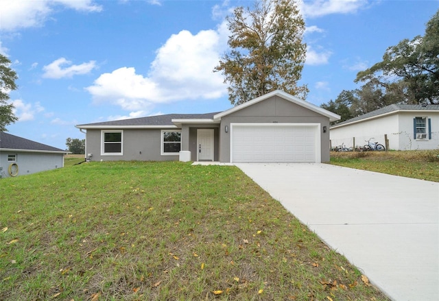 ranch-style house featuring a front yard and a garage