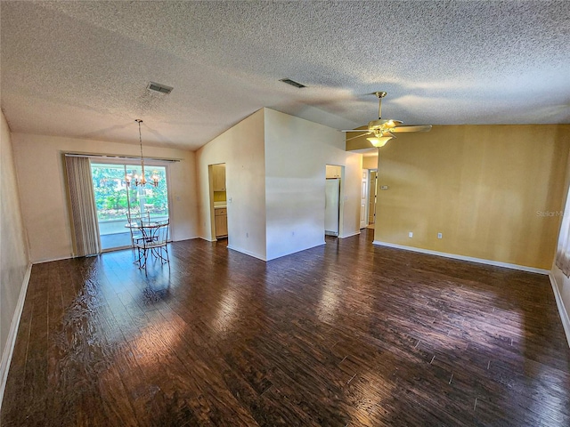 unfurnished room with a textured ceiling, lofted ceiling, ceiling fan with notable chandelier, and dark hardwood / wood-style floors