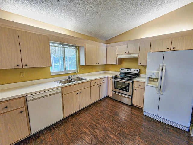 kitchen with light brown cabinets, white appliances, sink, vaulted ceiling, and dark wood-type flooring