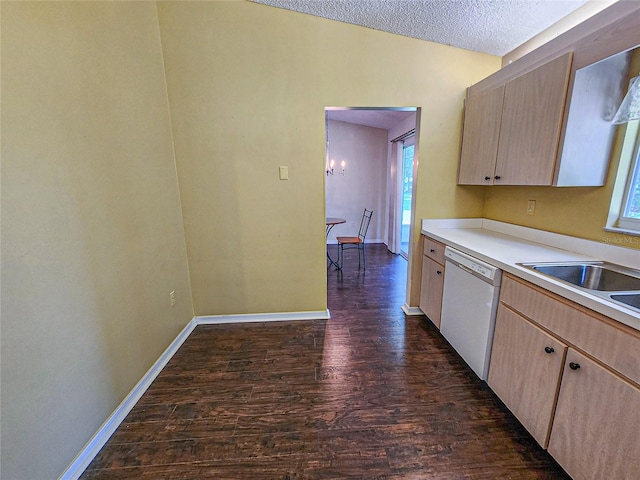 kitchen featuring light brown cabinets, a textured ceiling, dark hardwood / wood-style flooring, and white dishwasher