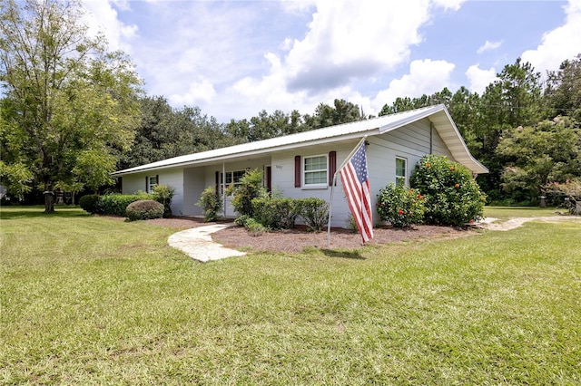 ranch-style home with a front yard