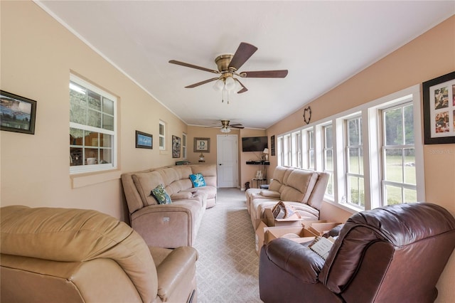 carpeted living room featuring ceiling fan and a wealth of natural light