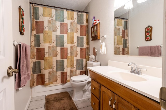 bathroom featuring vanity, tile patterned flooring, toilet, and a textured ceiling