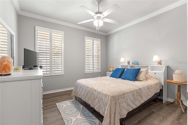 bedroom with crown molding, dark wood-type flooring, ceiling fan, and a textured ceiling