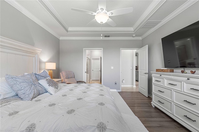 bedroom featuring crown molding, ceiling fan, dark hardwood / wood-style floors, and a tray ceiling