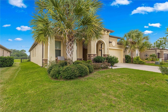 view of front of property with concrete driveway, stone siding, a front yard, and stucco siding