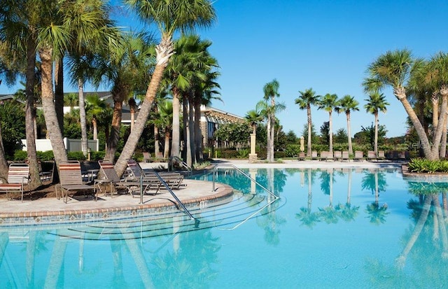 community pool with a patio