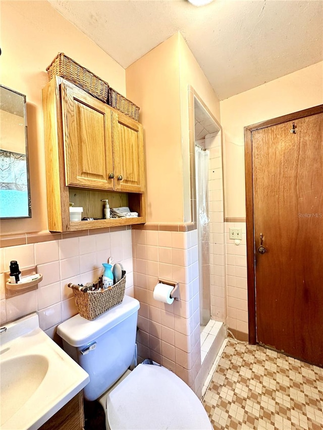 bathroom with walk in shower, tile walls, and toilet