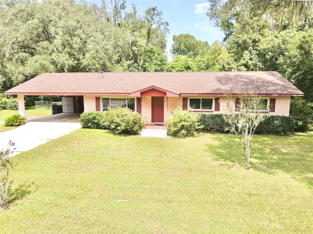 ranch-style home featuring a front yard and a carport