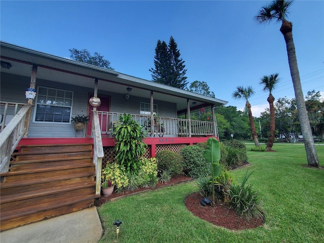 view of front of house featuring a front yard and a porch