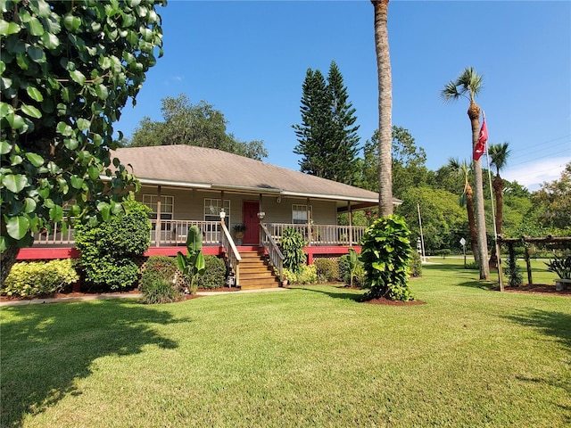 view of front facade featuring a front lawn and a deck