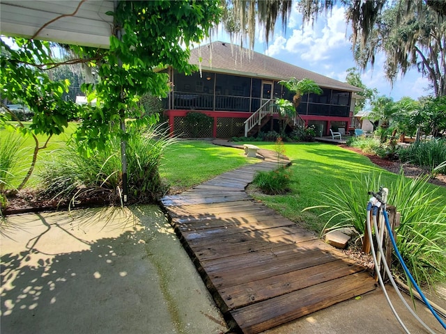 view of yard with a sunroom