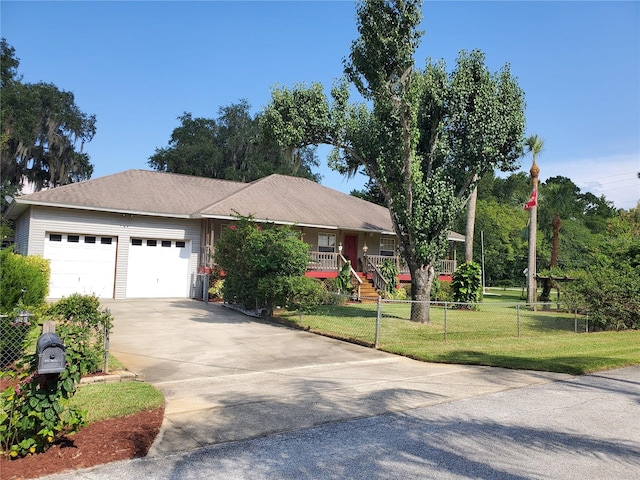 ranch-style house featuring a front lawn and a garage