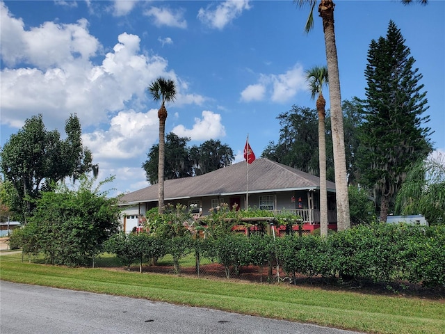 view of property exterior with a yard