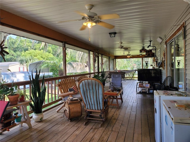 sunroom with ceiling fan and a healthy amount of sunlight