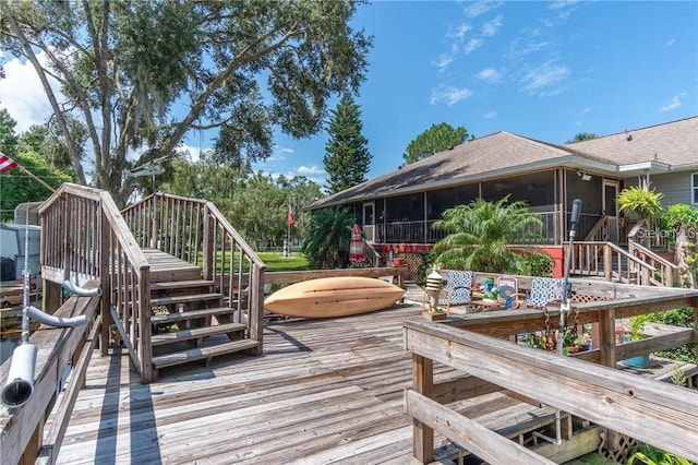 wooden deck with a sunroom