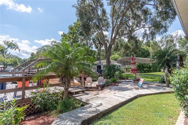 view of yard featuring a wooden deck