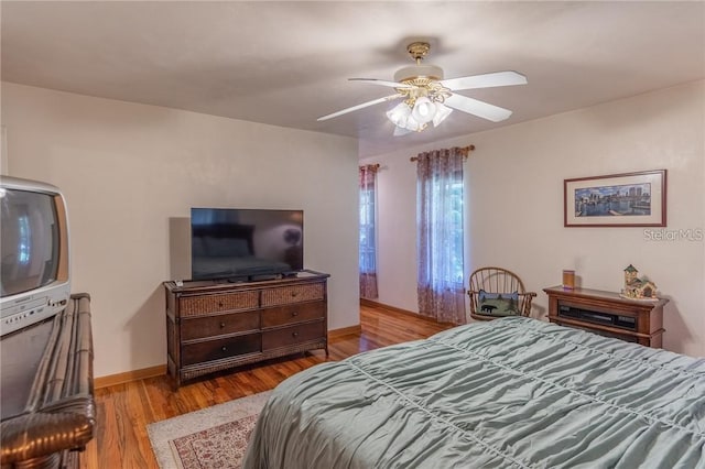 bedroom featuring ceiling fan and light wood-type flooring