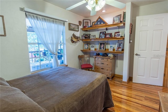 bedroom featuring ceiling fan and light hardwood / wood-style flooring