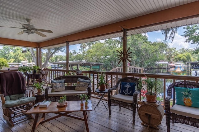 sunroom / solarium featuring ceiling fan and plenty of natural light