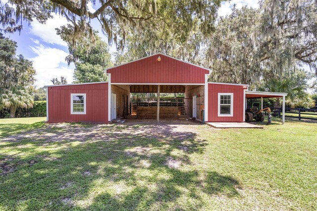 view of outbuilding with a yard