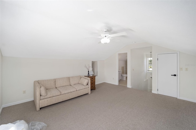 carpeted living room with lofted ceiling and ceiling fan