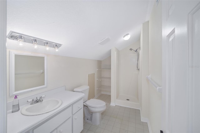 bathroom featuring a shower, toilet, vanity, and tile patterned flooring