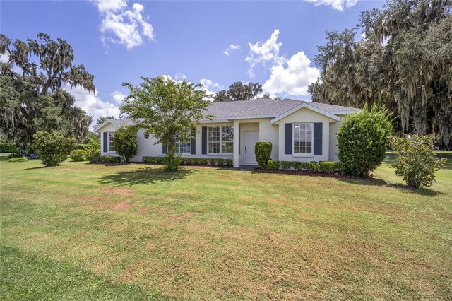 ranch-style house with a front yard