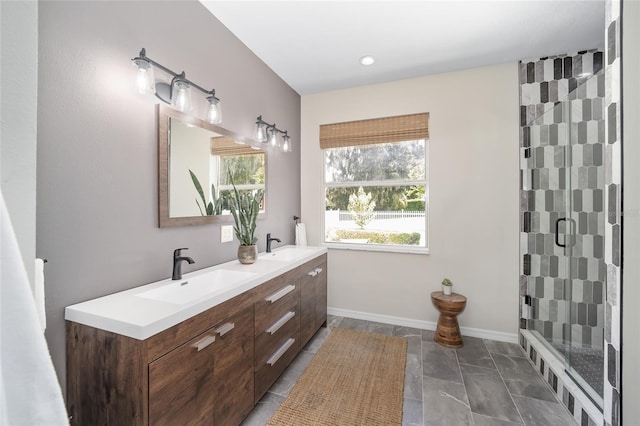 bathroom with walk in shower and vanity