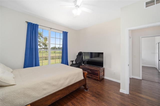 bedroom featuring ceiling fan and dark hardwood / wood-style floors