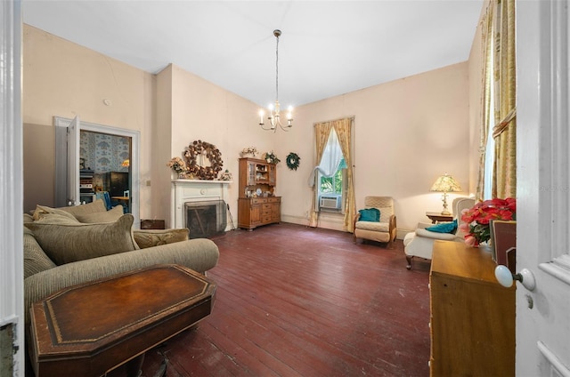 living room with dark wood-type flooring and a notable chandelier