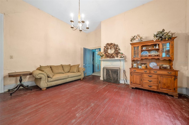 living room with hardwood / wood-style flooring and a notable chandelier