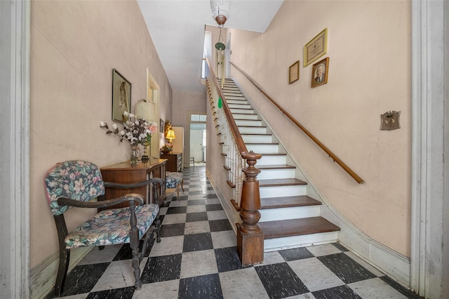 staircase with dark tile patterned flooring