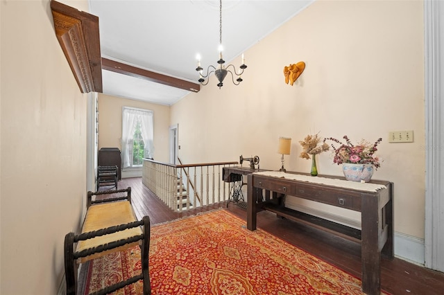 corridor with a notable chandelier, hardwood / wood-style floors, and beam ceiling