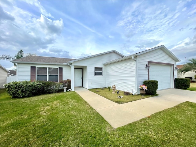 ranch-style house featuring an attached garage, a front lawn, and concrete driveway