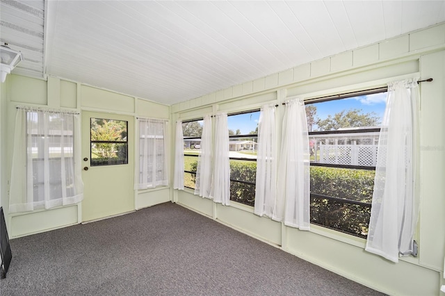 unfurnished sunroom featuring lofted ceiling