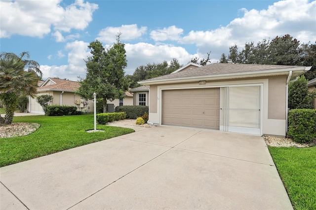 ranch-style home featuring a garage and a front lawn