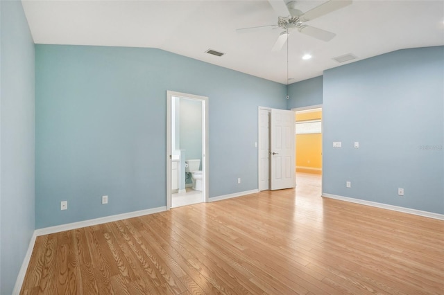 unfurnished bedroom featuring ceiling fan, light wood-type flooring, and ensuite bathroom