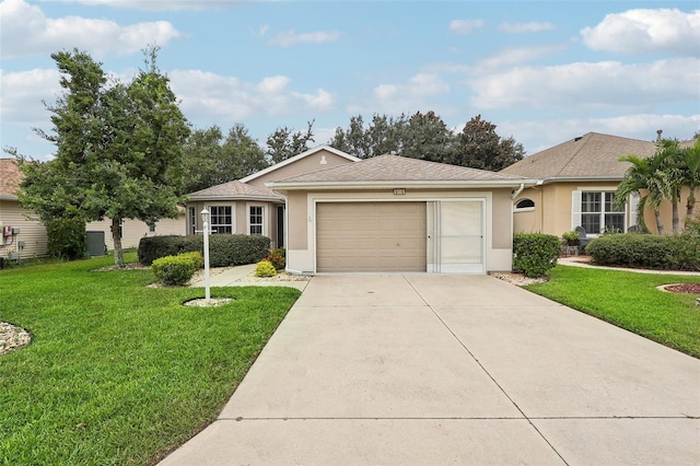 ranch-style home featuring a front lawn and a garage