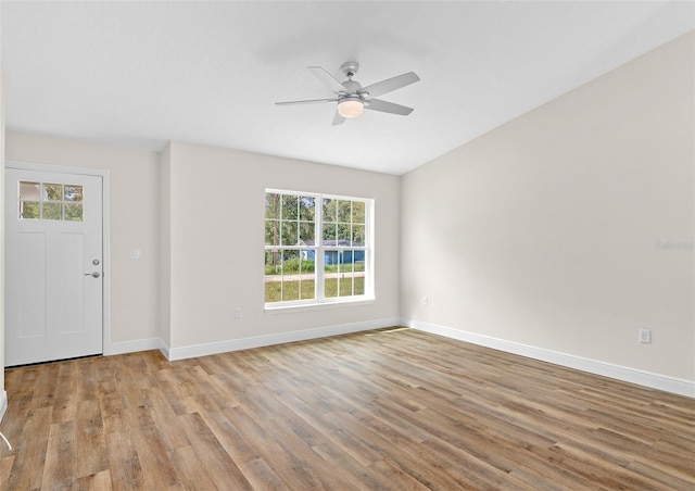 unfurnished room featuring ceiling fan, light hardwood / wood-style floors, and plenty of natural light