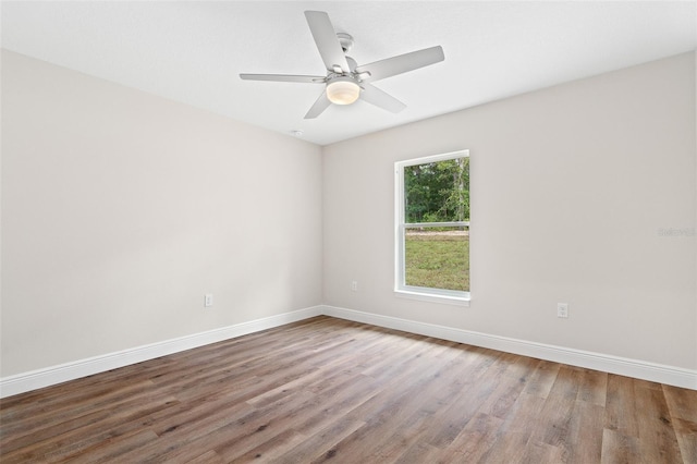 unfurnished room featuring ceiling fan and wood-type flooring