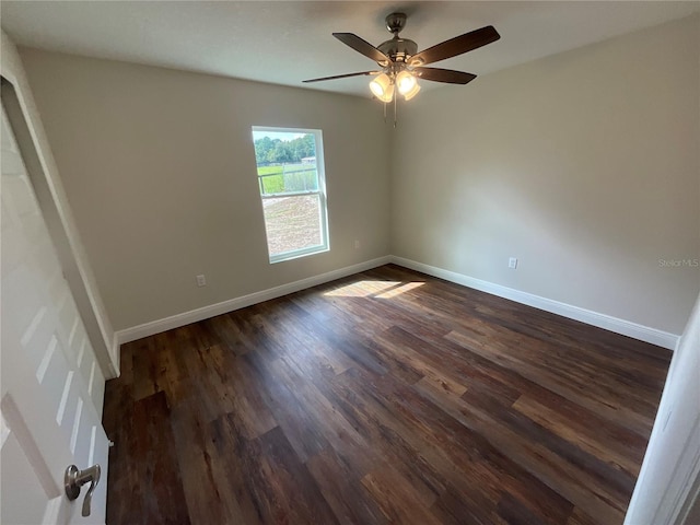 unfurnished room with ceiling fan and dark hardwood / wood-style floors