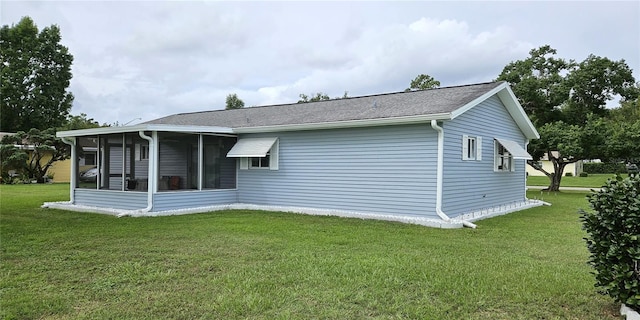 view of property exterior featuring a lawn and a sunroom